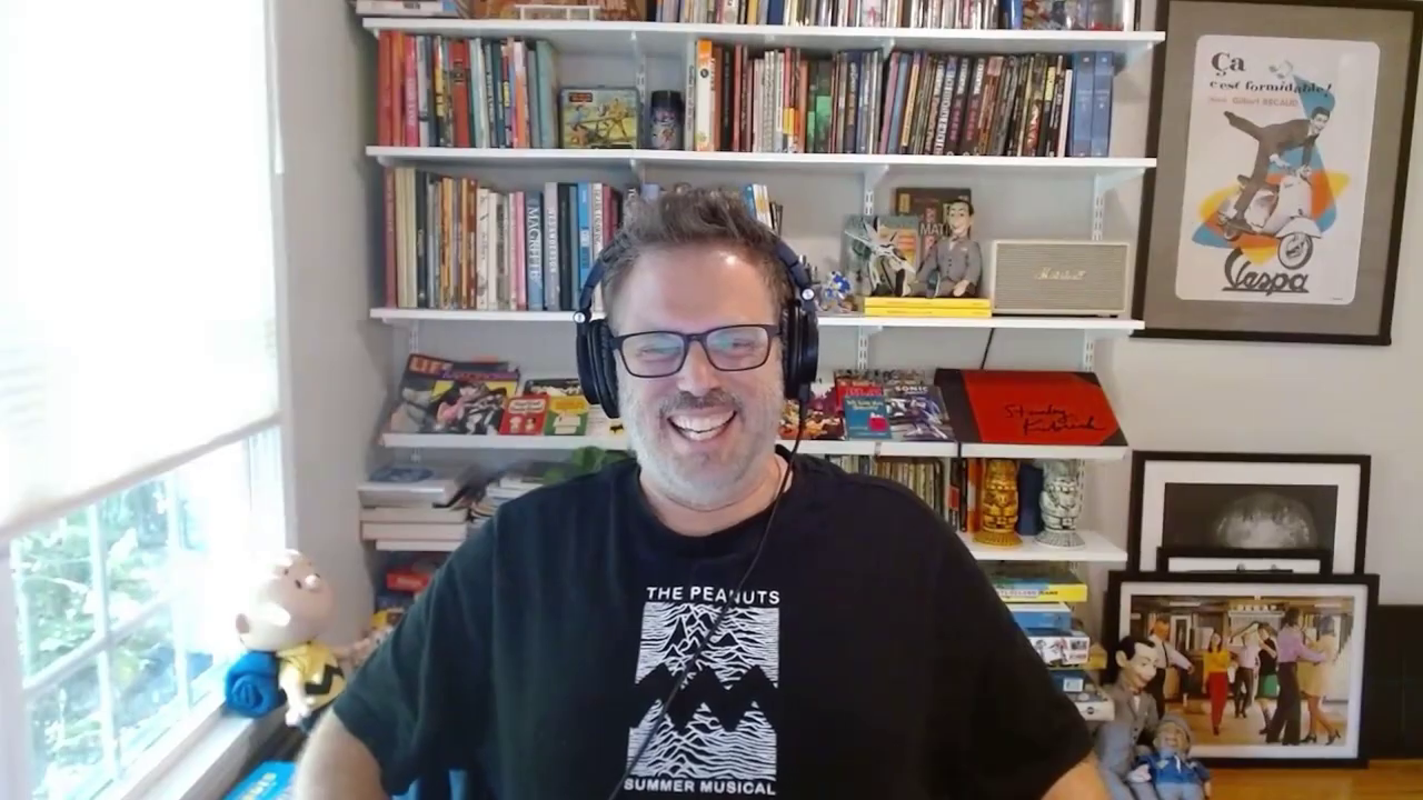 Erik Wiese with a Joy Division shirt that reads Peanuts Summer Musical